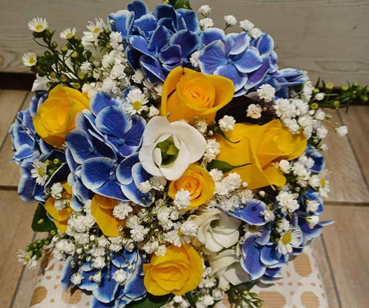 Au Lys d'Or conçoit des arrangements floraux pour mariage.